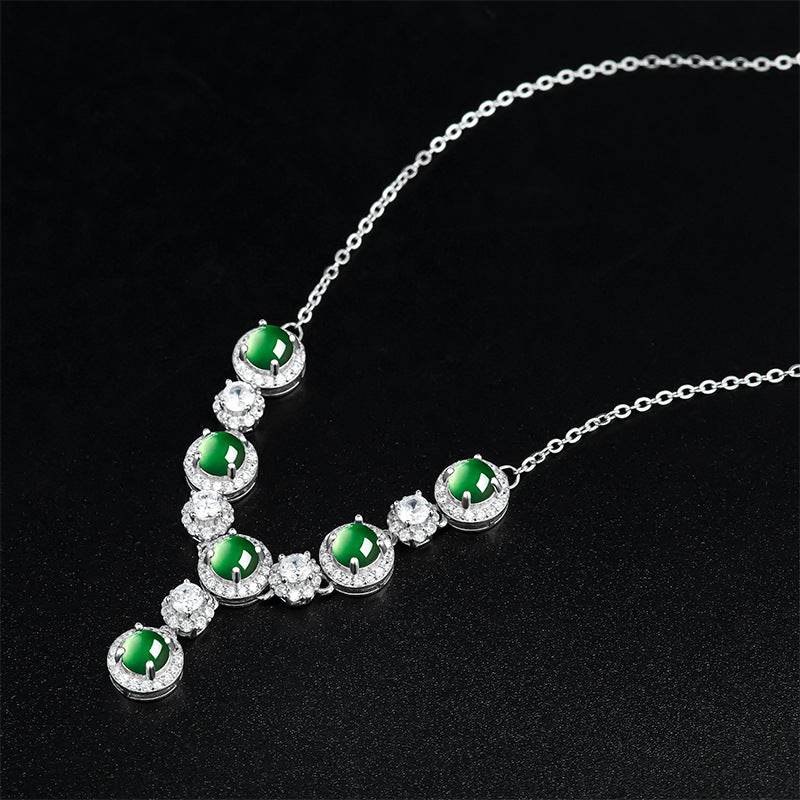 Close-up of natural jade cabochons with sparkling zircon accents