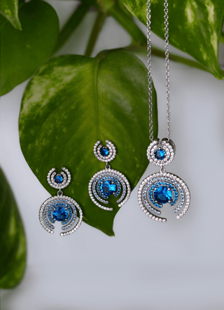 Exquisite jewelry set from the She is Nyxsara Collection featuring a platinum-plated necklace and matching earrings