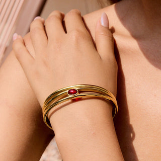 Minimalist open cuff bracelet with red gemstone