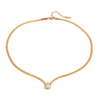 Gold chain necklace with a small pendant on a white background