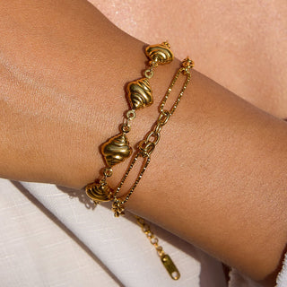 18K gold-plated shell charm bracelet flat lay