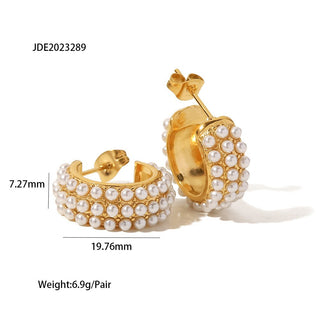 Gold hoop earrings with pearl detailing on a white background, showing measurements and weight.
