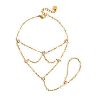 Gold chain bracelet with small crystals on a white background