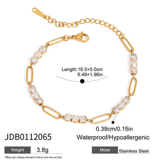 Gold bracelet with clear stones on a white background
