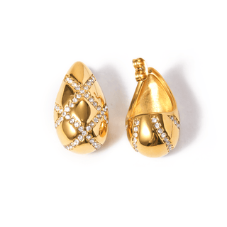Gold earrings with diamond accents on a white background