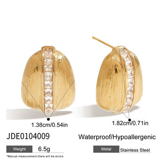 Gold earrings with clear stones on a white background
