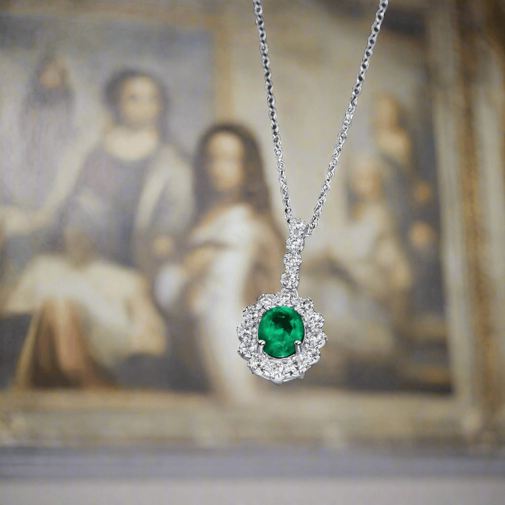 Close-up of emerald-cut emerald pendant in platinum silver setting
