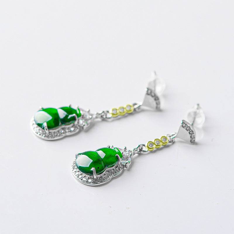 Close-up of jade and zirconia earrings in gourd form – Yadman Emarati