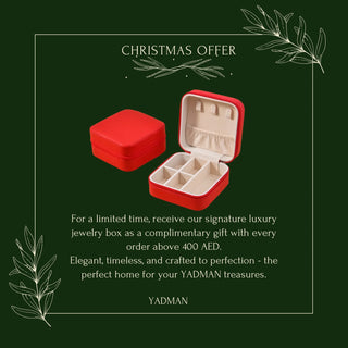Red jewelry box with open lid on a green background with Christmas offer text.