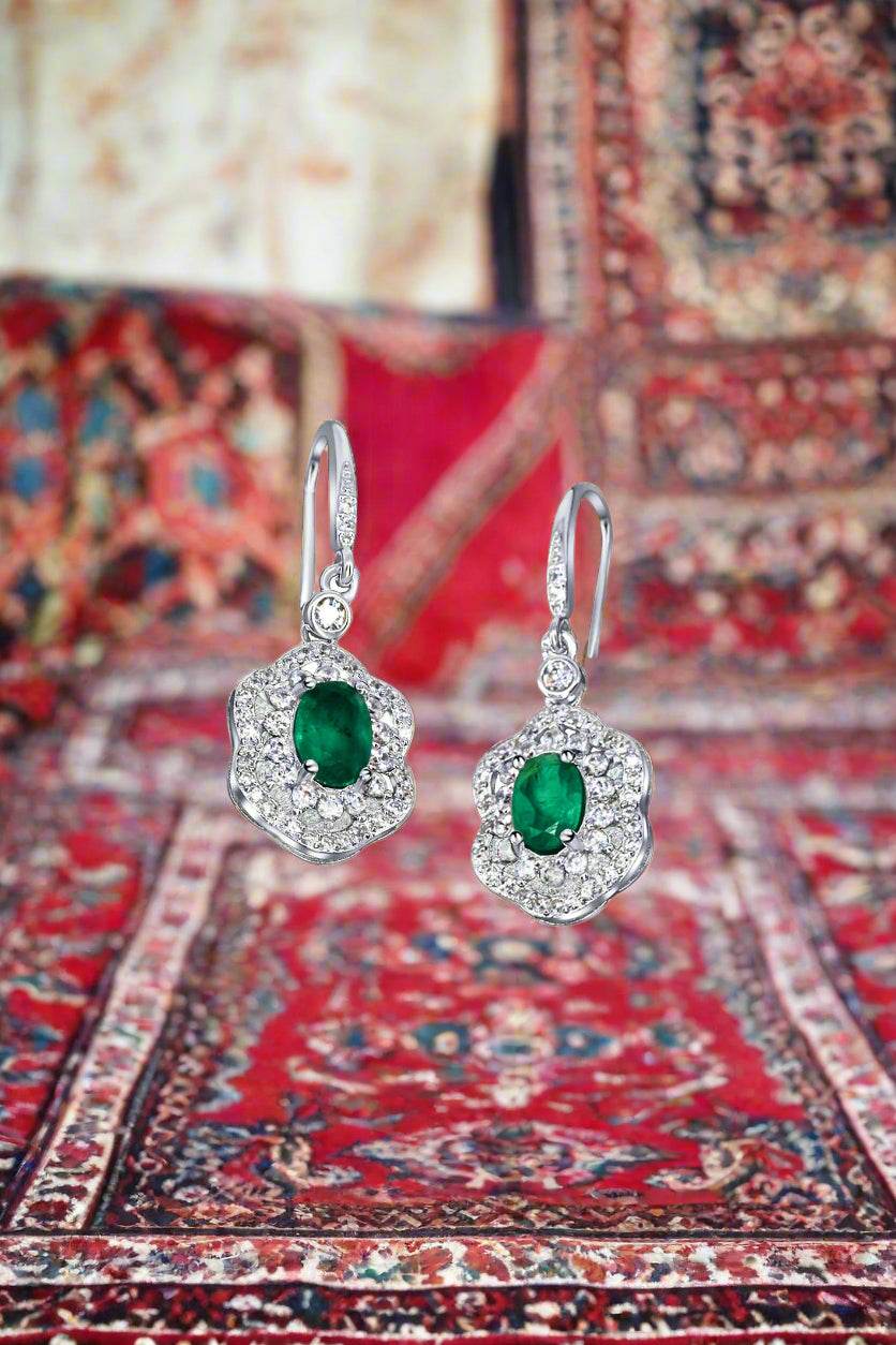 Luxury women’s earrings featuring real emerald gemstones and crystal accents