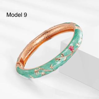 Handcrafted enamel bangle in teal with gold peony outlines