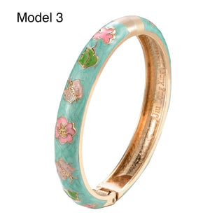 Hand-painted mint green enamel bracelet featuring rose gold floral details