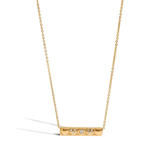 Gold necklace with a bar pendant on a white background