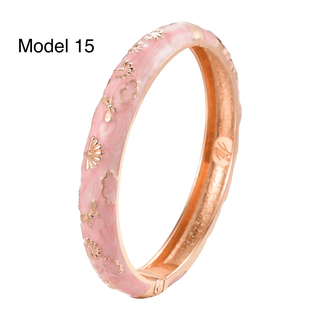 Pink ring with gold accents on a white background