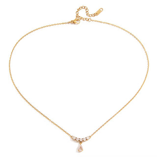 Gold necklace with a small pendant on a white background