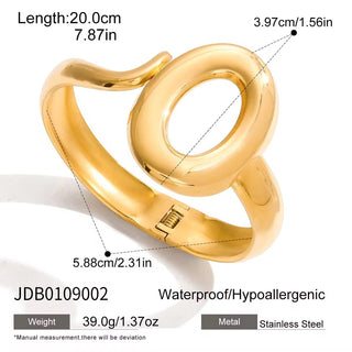Gold ring with measurements and product details on a white background
