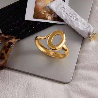 Gold ring on a laptop with a blurred background