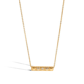 Gold necklace with a bar pendant on a white background