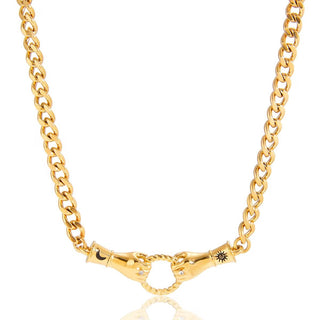 Gold chain necklace with a unique clasp design on a white background