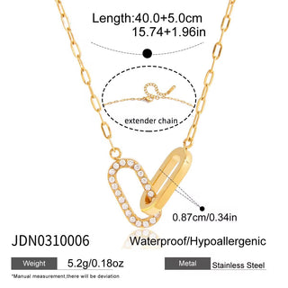 Gold necklace with heart-shaped pendant and extender chain details on a white background
