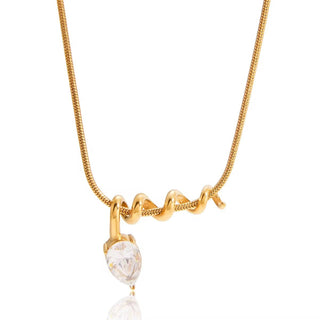 Close-up of spiral gold pendant necklace