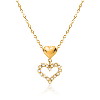 Gold heart-shaped necklace with a smaller heart pendant on a white background