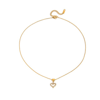 Gold necklace with a heart-shaped pendant on a white background