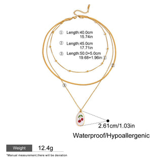 Gold necklace with a pendant, showing measurements and product details on a white background.