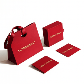 Red 'YADMAN EMARATI' branded packaging set on a white background