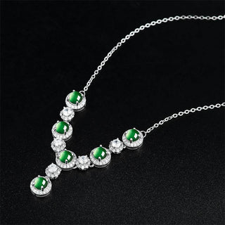 Close-up of natural jade cabochons with sparkling zircon accents