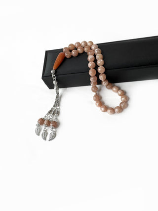 Side view of natural sunstone misbaha, handmade for daily spiritual reflection