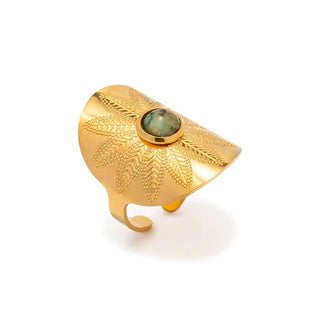 Gold ring with leaf patterns and a green stone on a white background