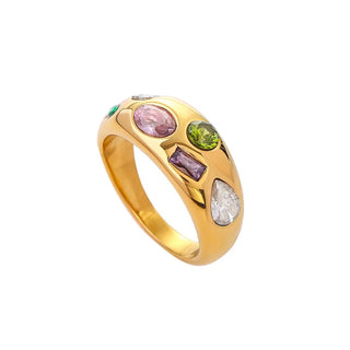 Gold ring with colorful gemstones on a white background