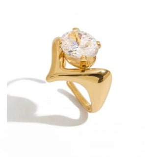 Gold ring with a large diamond on a white background