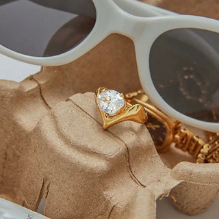 Abstract design ring with white zircon center