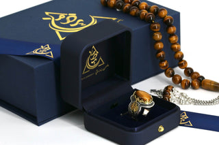 Close-up of tiger eye gemstone with golden bands in polished silver ring